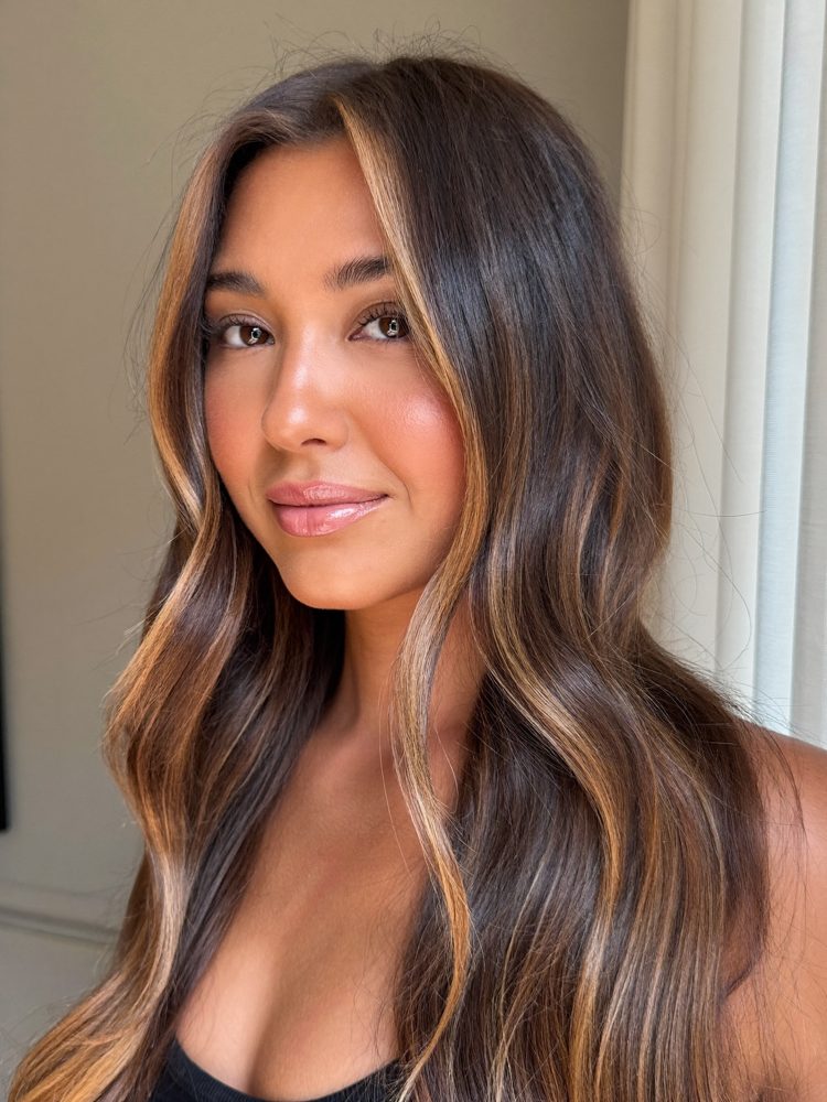 Lange, weich gewellte Haare mit warmer Balayage